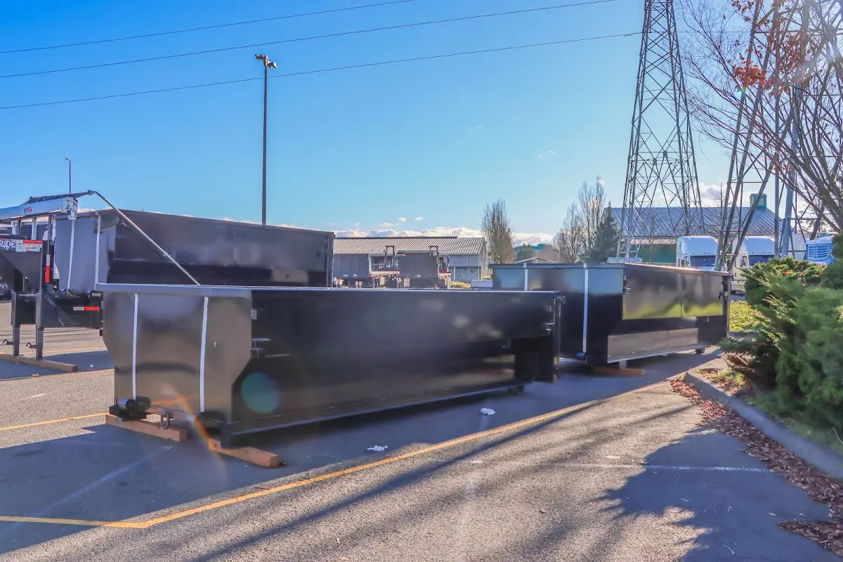 Roll-off dumpster ready for waste disposal at job site for 3 Yard Dumpster Rental in Lenox